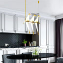 Bird chandelier suspended above a dining table